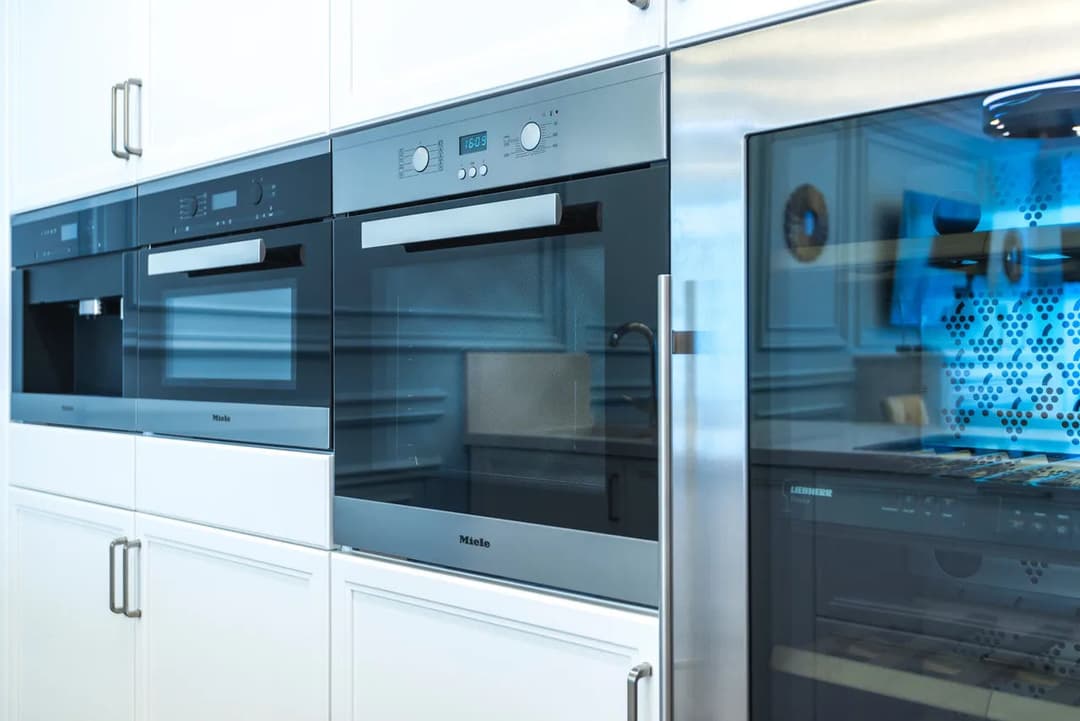 Modern kitchen with Miele built-in ovens featuring sleek design and stainless steel accents.