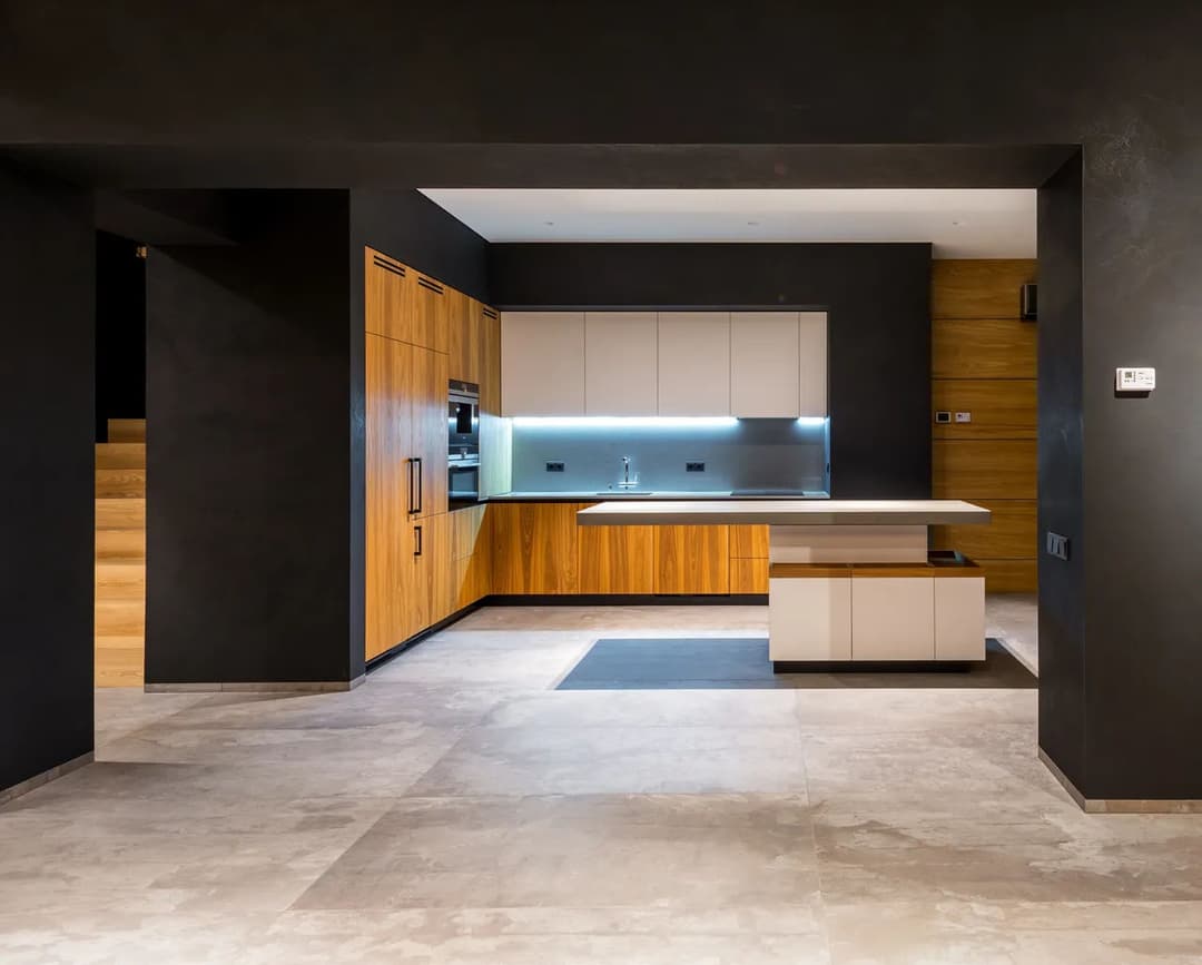 Modern kitchen with wooden cabinets, sleek countertops, and a minimalist design.