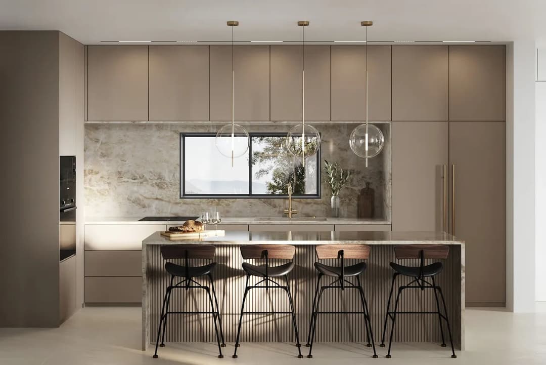 Modern kitchen with neutral tones, elegant pendant lights, and a sleek island with bar stools.
