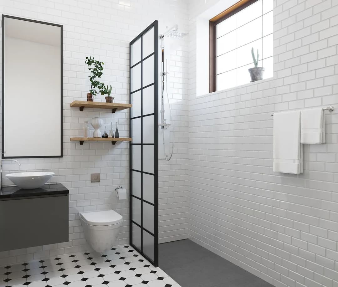 Modern bathroom featuring a glass shower, stylish shelving, and sleek design elements.