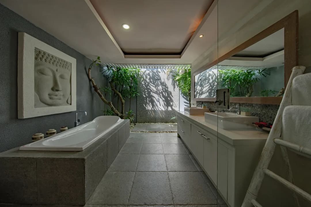 Luxurious modern bathroom featuring a freestanding bathtub and serene indoor plants.